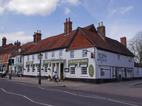 The George, home of Bel & the Dragon, a white-painted old inn on Odiham High Street