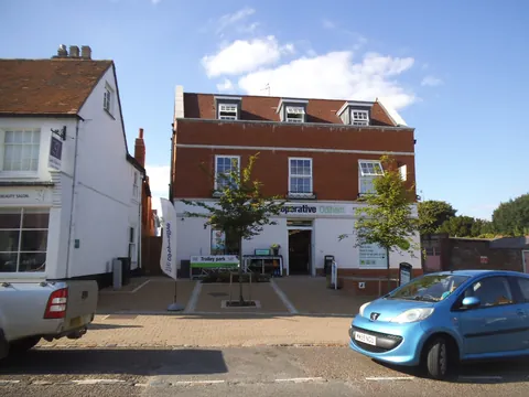 The Co-op on Odiham High Street, a brick building with a small car park