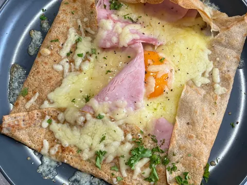 A golden buckwheat galette with ham, cheese and egg