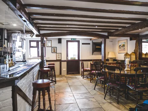The beamed bar and dining area inside the Derby Inn