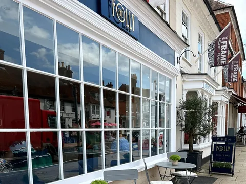 The Folly Coffee Bar on Odiham High Street, with tables and chairs outside its big windows